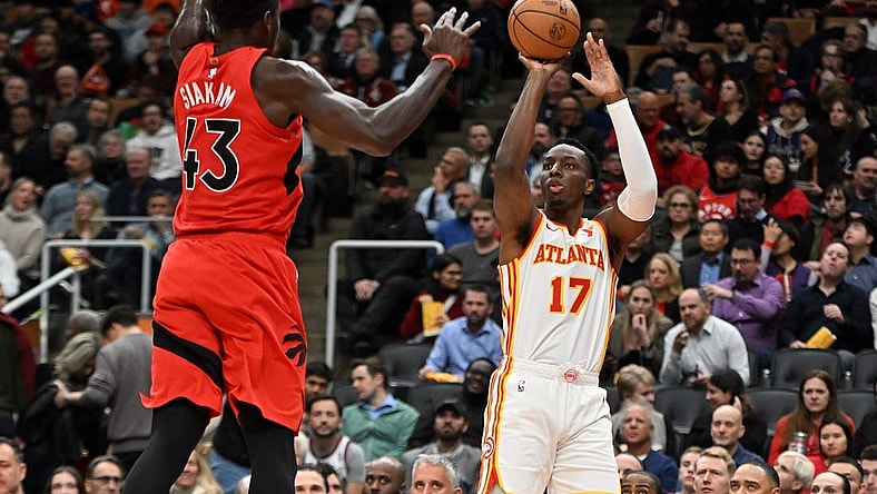 Dec 13, 2023; Toronto, Ontario, CAN;   Atlanta Hawks forward Onyeka Okongwu (17) shoots the ball as Toronto Raptors forward Pascal Siakam (43) defends in the first half at Scotiabank Arena. Mandatory Credit: Dan Hamilton-USA TODAY Sports