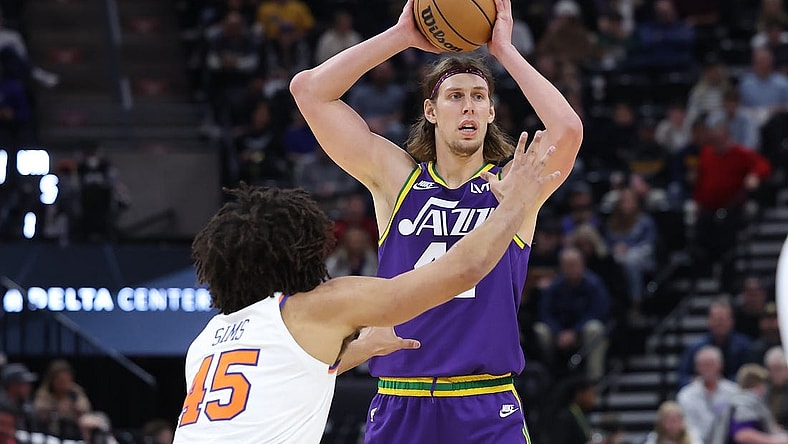 Dec 13, 2023; Salt Lake City, Utah, USA; Utah Jazz forward Kelly Olynyk (41) looks to pass the ball against New York Knicks center Jericho Sims (45) during the third quarter at Delta Center. Mandatory Credit: Rob Gray-USA TODAY Sports