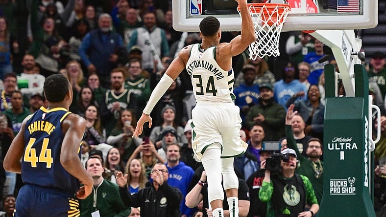 Dec 13, 2023; Milwaukee, Wisconsin, USA; Milwaukee Bucks forward Giannis Antetokounmpo (34) scores 64 points in the fourth quarter against the Indiana Pacers to set a team record for most points scored in a game at Fiserv Forum. Mandatory Credit: Benny Sieu-USA TODAY Sports