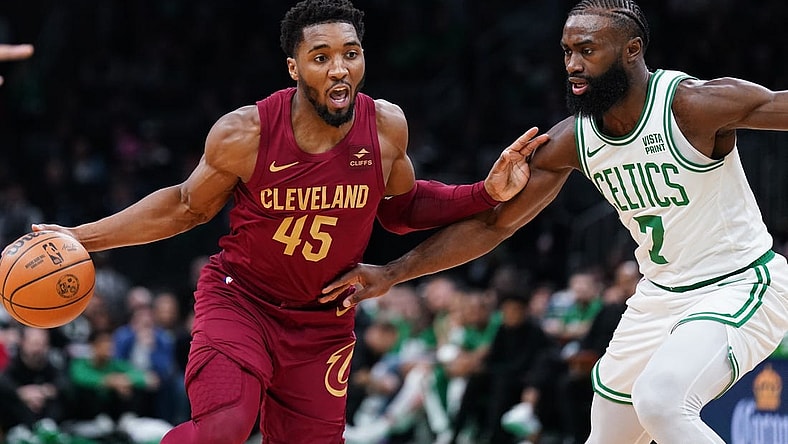Dec 14, 2023; Boston, Massachusetts, USA; Cleveland Cavaliers guard Donovan Mitchell (45) drives the ball against Boston Celtics guard Jaylen Brown (7) in the first quarter at TD Garden. Mandatory Credit: David Butler II-USA TODAY Sports