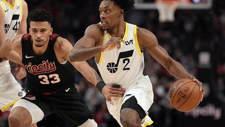 Dec 14, 2023; Portland, Oregon, USA; Utah Jazz point guard Collin Sexton (2) dribbles the ball while defended by Portland Trail Blazers forward Toumani Camara (33) during the first half at Moda Center. Mandatory Credit: Soobum Im-USA TODAY Sports