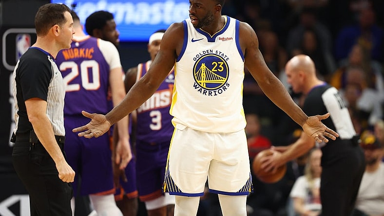 Dec 12, 2023; Phoenix, Arizona, USA; Golden State Warriors forward Draymond Green (23) reacts as he argues with an NBA referee against the Phoenix Suns at Footprint Center. Mandatory Credit: Mark J. Rebilas-USA TODAY Sports