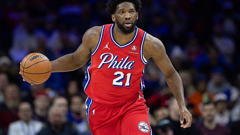 Dec 15, 2023; Philadelphia, Pennsylvania, USA; Philadelphia 76ers center Joel Embiid (21) dribbles up court against the Detroit Pistons during the first quarter at Wells Fargo Center. Mandatory Credit: Bill Streicher-USA TODAY Sports
