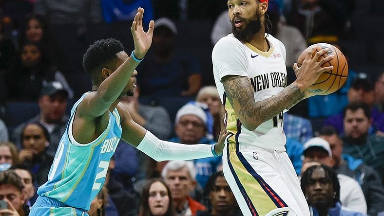 Dec 15, 2023; Charlotte, North Carolina, USA; New Orleans Pelicans forward Brandon Ingram (14) looks to pass over Charlotte Hornets forward Brandon Miller (24) during the first quarter at Spectrum Center. Mandatory Credit: Nell Redmond-USA TODAY Sports
