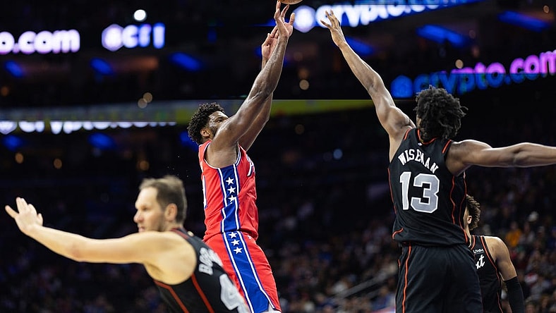 Dec 15, 2023; Philadelphia, Pennsylvania, USA; Philadelphia 76ers center Joel Embiid (21) shoots past Detroit Pistons center James Wiseman (13) during the second quarter at Wells Fargo Center. Mandatory Credit: Bill Streicher-USA TODAY Sports
