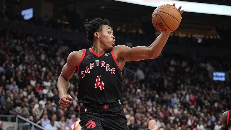 Dec 15, 2023; Toronto, Ontario, CAN; Toronto Raptors forward Scottie Barnes (4) grabs a rebound against the Atlanta Hawks during the first half at Scotiabank Arena. Mandatory Credit: John E. Sokolowski-USA TODAY Sports