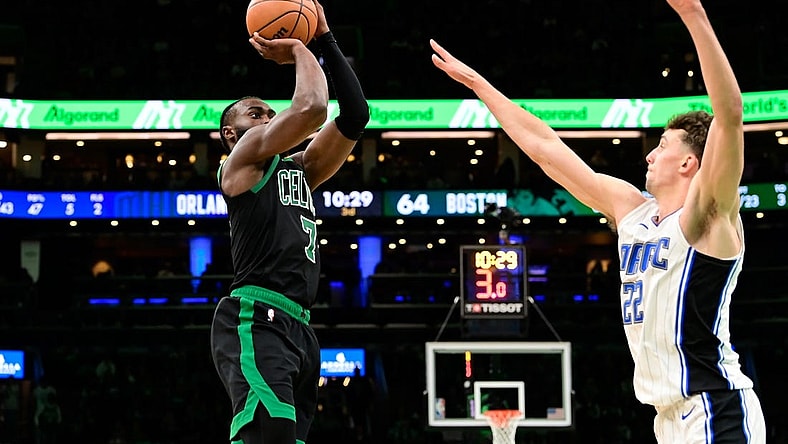 Dec 15, 2023; Boston, Massachusetts, USA; Boston Celtics guard Jaylen Brown (7) shoots the ball over Orlando Magic forward Franz Wagner (22) during the second half at TD Garden. Mandatory Credit: Eric Canha-USA TODAY Sports