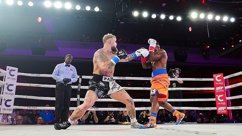 Dec 15, 2023; Orlando, Florida, USA; Jake Paul fights Andre August in the first round at the Caribe Royale Orlando. Mandatory Credit: Nathan Ray Seebeck-USA TODAY Sports