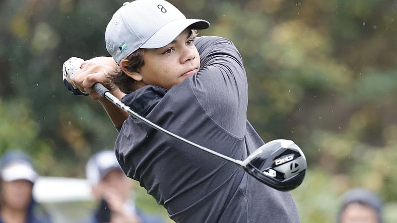 Dec 16, 2023; Orlando, Florida, USA; Charlie Woods plays his shot from the sixth tee during the PNC Championship at The Ritz-Carlton Golf Club. Mandatory Credit: Reinhold Matay-USA TODAY Sports