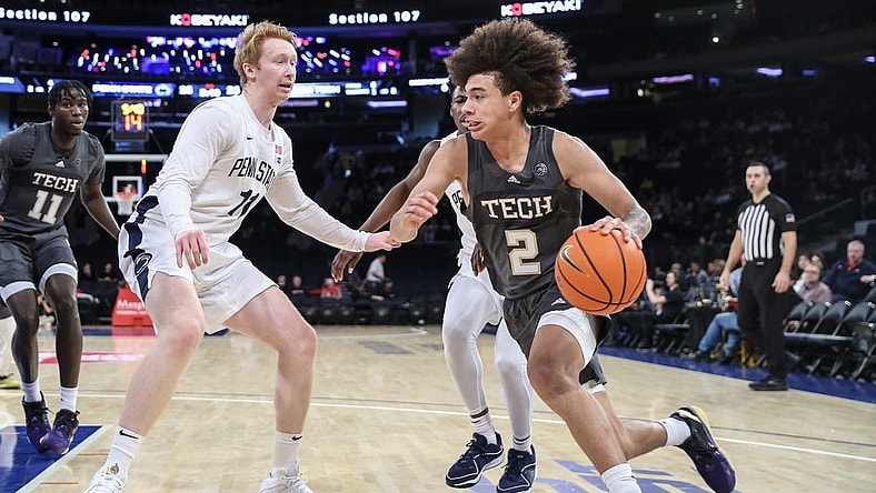 Dec 16, 2023; New York, New York, USA;  Georgia Tech Yellow Jackets guard Naithan George (2) drives past Penn State Nittany Lions forward Leo O'Boyle (11) in the first half at Madison Square Garden. Mandatory Credit: Wendell Cruz-USA TODAY Sports