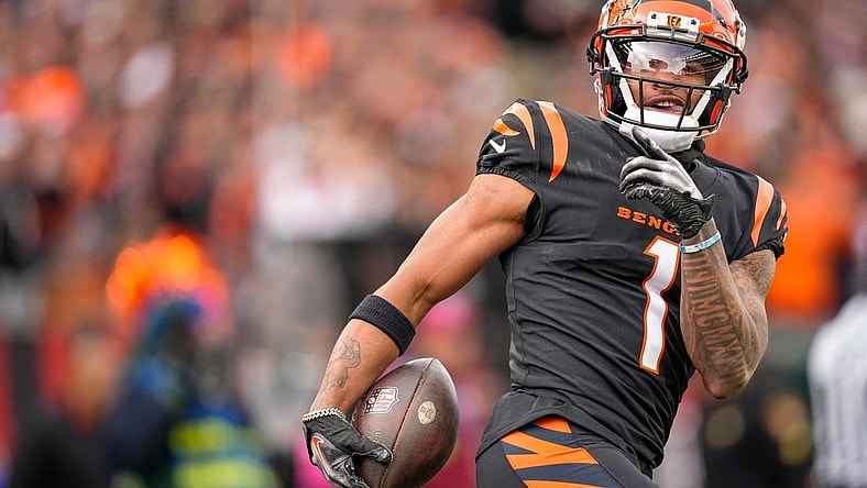 Cincinnati Bengals wide receiver Ja'Marr Chase (1) smiles after completing a deep pass in the first quarter of the NFL Week 15 game between the Cincinnati Bengals and the Minnesota Vikings at PayCor Stadium in downtown Cincinnati on Saturday, Dec. 16, 2023.