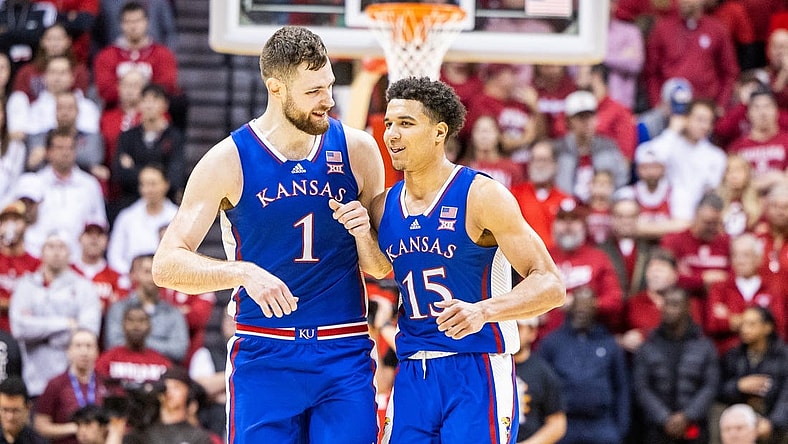 Dec 16, 2023; Bloomington, Indiana, USA; Kansas Jayhawks center Hunter Dickinson (1) and  guard Kevin McCullar Jr. (15) celebrate in the second half against the Indiana Hoosiers at Simon Skjodt Assembly Hall. Mandatory Credit: Trevor Ruszkowski-USA TODAY Sports