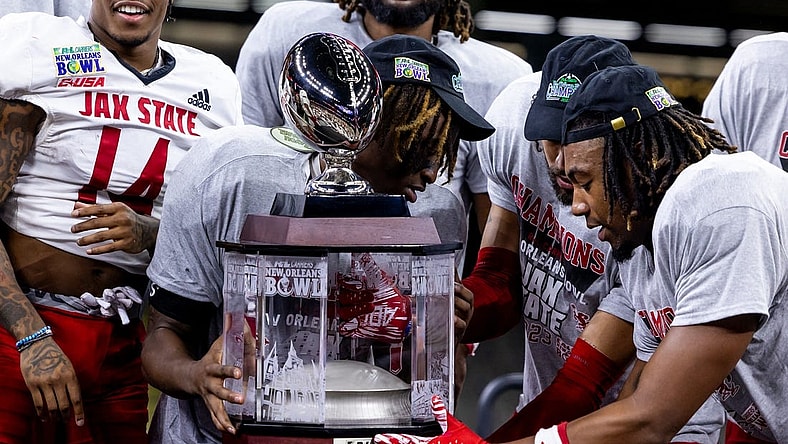Dec 16, 2023; New Orleans, LA, USA;  Jacksonville State Gamecocks hold up the game trophy after the game against the Louisiana-Lafayette Ragin Cajuns at the Caesars Superdome. Mandatory Credit: Stephen Lew-USA TODAY Sports
