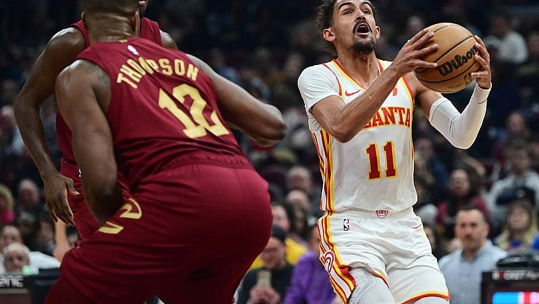 Dec 16, 2023; Cleveland, Ohio, USA; Atlanta Hawks guard Trae Young (11) drives to the basket against the Cleveland Cavaliers during the first half at Rocket Mortgage FieldHouse. Mandatory Credit: Ken Blaze-USA TODAY Sports