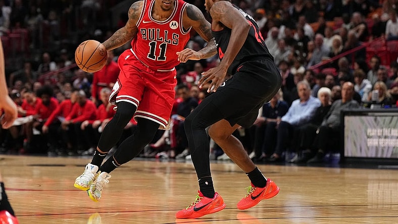Dec 16, 2023; Miami, Florida, USA; Chicago Bulls forward DeMar DeRozan (11) drives the ball around Miami Heat forward Haywood Highsmith (24) during the first half at Kaseya Center. Mandatory Credit: Jasen Vinlove-USA TODAY Sports