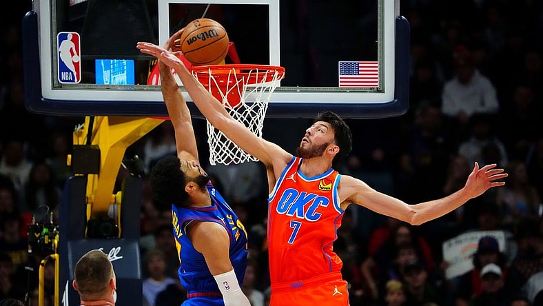 Dec 16, 2023; Denver, Colorado, USA; Denver Nuggets guard Jamal Murray (27) scores against Oklahoma City Thunder forward Chet Holmgren (7) in the first quarter at Ball Arena. Mandatory Credit: Ron Chenoy-USA TODAY Sports