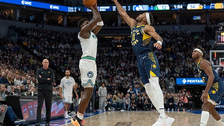 Dec 16, 2023; Minneapolis, Minnesota, USA; Minnesota Timberwolves guard Anthony Edwards (5) hits a three point basket defended by Indiana Pacers forward Bruce Brown (11) in the second quarter at Target Center. Mandatory Credit: Matt Blewett-USA TODAY Sports