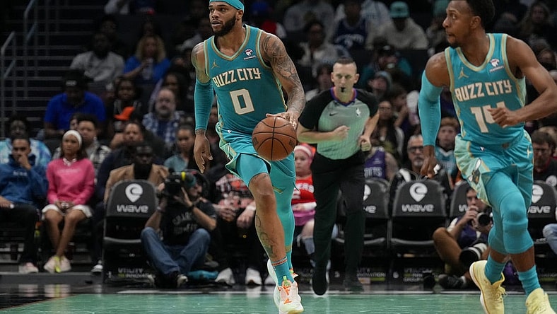 Dec 16, 2023; Charlotte, North Carolina, USA; Charlotte Hornets forward Miles Bridges (0) brings the ball up court against the Philadelphia 76ers during the second half at Spectrum Center. Mandatory Credit: Jim Dedmon-USA TODAY Sports