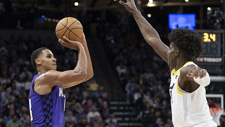 December 16, 2023; Sacramento, California, USA; Sacramento Kings forward Keegan Murray (13) shoots the basketball against Utah Jazz forward Taylor Hendricks (0) during the third quarter at Golden 1 Center. Mandatory Credit: Kyle Terada-USA TODAY Sports