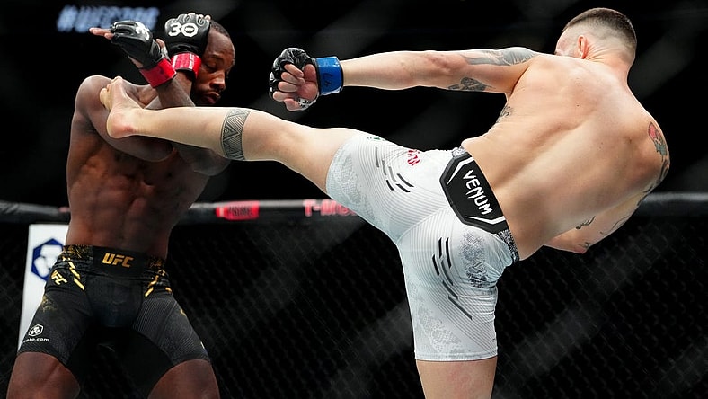 Dec 16, 2023; Las Vegas, Nevada, USA; Leon Edwards (red gloves) fights Colby Covington (blue gloves) during UFC 296 at T-Mobile Arena. Mandatory Credit: Stephen R. Sylvanie-USA TODAY Sports