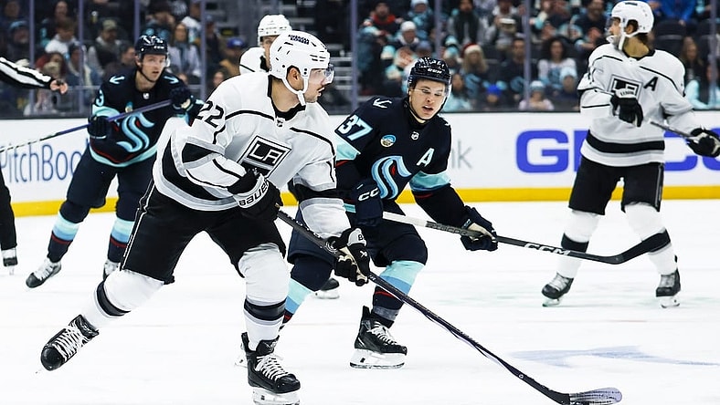 Dec 16, 2023; Seattle, Washington, USA; Los Angeles Kings left wing Kevin Fiala (22) looks to pass the puck against the Seattle Kraken during the second period at Climate Pledge Arena. Mandatory Credit: Joe Nicholson-USA TODAY Sports