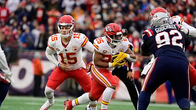 Dec 17, 2023; Foxborough, Massachusetts, USA; Kansas City Chiefs quarterback Patrick Mahomes (15) hands the ball off to running back Clyde Edwards-Helaire (25) during the first half against the New England Patriots at Gillette Stadium. Mandatory Credit: Eric Canha-USA TODAY Sports