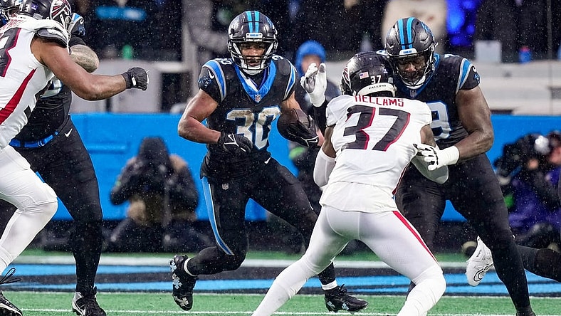 Dec 17, 2023; Charlotte, North Carolina, USA; Carolina Panthers running back Chuba Hubbard (30) runs the ball against the Atlanta Falcons during the second quarter at Bank of America Stadium. Mandatory Credit: Jim Dedmon-USA TODAY Sports