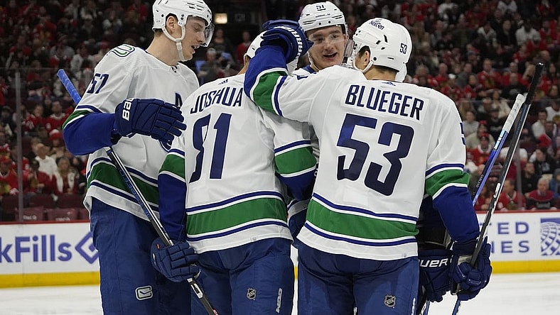 Dec 17, 2023; Chicago, Illinois, USA; Vancouver Canucks center Dakota Joshua (81) celebrates his goal against the Chicago Blackhawks during the second period at United Center. Mandatory Credit: David Banks-USA TODAY Sports