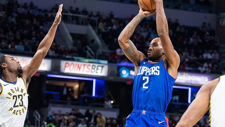 Dec 18, 2023; Indianapolis, Indiana, USA; LA Clippers forward Kawhi Leonard (2) shoots the ball while Indiana Pacers forward Aaron Nesmith (23) defends in the first quarter at Gainbridge Fieldhouse. Mandatory Credit: Trevor Ruszkowski-USA TODAY Sports