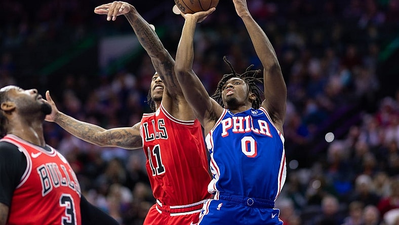 Dec 18, 2023; Philadelphia, Pennsylvania, USA; Philadelphia 76ers guard Tyrese Maxey (0) drives for a shot against Chicago Bulls forward DeMar DeRozan (11) during the second quarter at Wells Fargo Center. Mandatory Credit: Bill Streicher-USA TODAY Sports