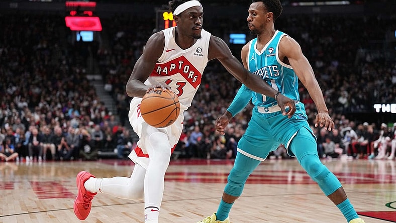 Dec 18, 2023; Toronto, Ontario, CAN; Toronto Raptors forward Pascal Siakam (43) drives to the basket as Charlotte Hornets guard Ish Smith (14) tries to defend during the second quarter at Scotiabank Arena. Mandatory Credit: Nick Turchiaro-USA TODAY Sports