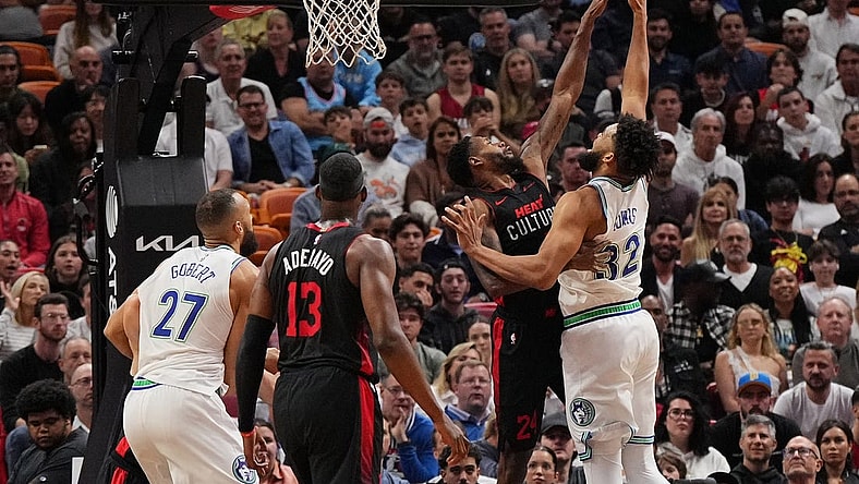 Dec 18, 2023; Miami, Florida, USA; Miami Heat forward Haywood Highsmith (24) blocks the shot of Minnesota Timberwolves center Karl-Anthony Towns (32) during the first half at Kaseya Center. Mandatory Credit: Jasen Vinlove-USA TODAY Sports