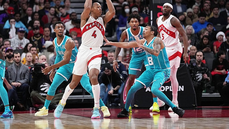 Dec 18, 2023; Toronto, Ontario, CAN; Toronto Raptors forward Scottie Barnes (4) controls the ball as Charlotte Hornets guard Nick Smith Jr. (8) tries to defend during the fourth quarter at Scotiabank Arena. Mandatory Credit: Nick Turchiaro-USA TODAY Sports