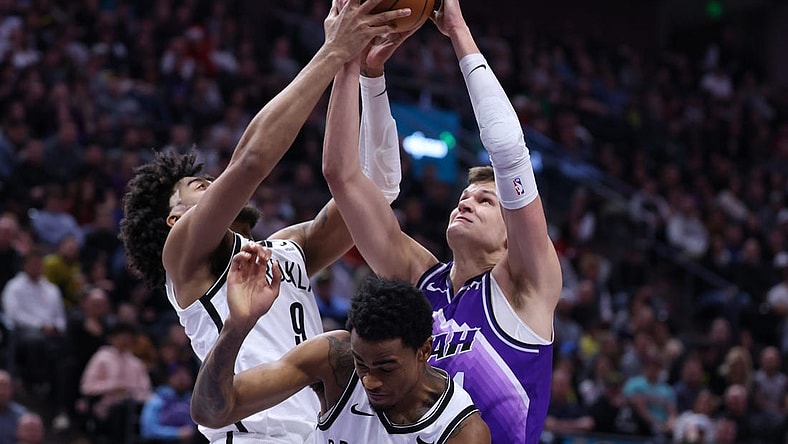 Dec 18, 2023; Salt Lake City, Utah, USA; Brooklyn Nets forward Trendon Watford (9) and Utah Jazz center Walker Kessler (24) battle for a rebound during the second quarter at Delta Center. Mandatory Credit: Rob Gray-USA TODAY Sports
