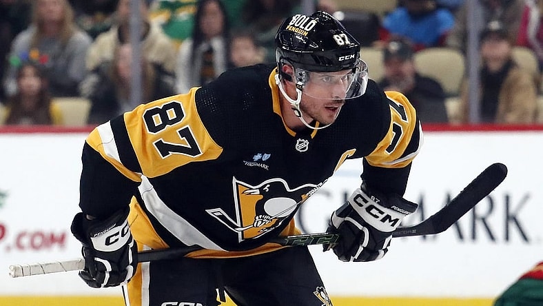 Dec 18, 2023; Pittsburgh, Pennsylvania, USA;  Pittsburgh Penguins center Sidney Crosby (87) prepares to take a face-off against the Minnesota Wild during the third period at PPG Paints Arena. Pittsburgh won 4-3. Mandatory Credit: Charles LeClaire-USA TODAY Sports