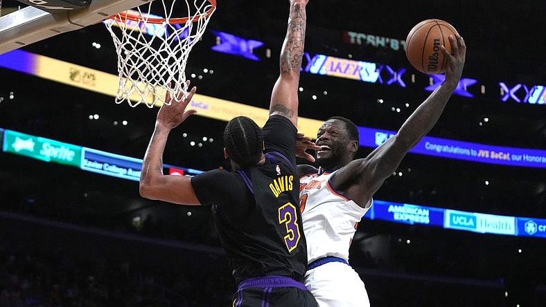 Dec 18, 2023; Los Angeles, California, USA; New York Knicks forward Julius Randle (30) shoots the ball against Los Angeles Lakers forward Anthony Davis (3) at Crypto.com Arena. Mandatory Credit: Kirby Lee-USA TODAY Sports