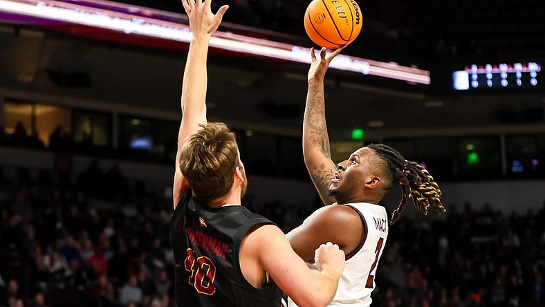 Dec 19, 2023; Columbia, South Carolina, USA; South Carolina Gamecocks forward B.J. Mack (2) shoots over Winthrop Eagles center Alex Timmerman (40) in the first half at Colonial Life Arena. Mandatory Credit: Jeff Blake-USA TODAY Sports