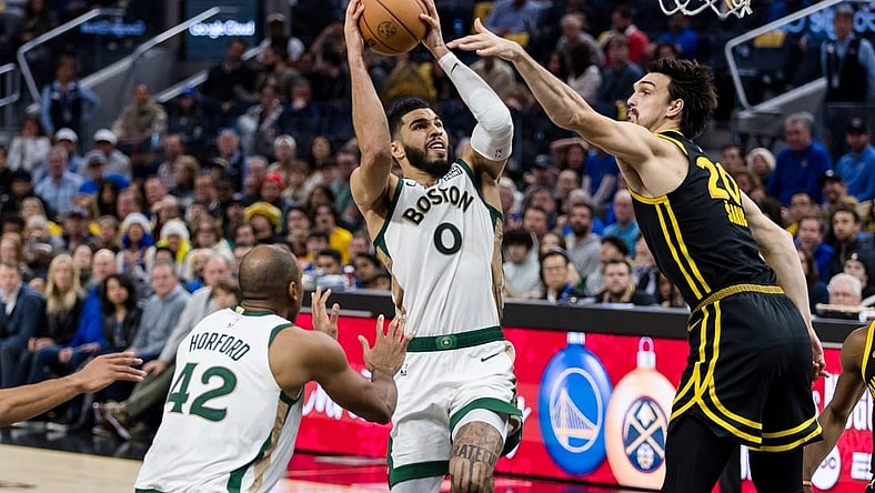 Dec 19, 2023; San Francisco, California, USA; Golden State Warriors forward Dario Saric (20) defends Boston Celtics forward Jayson Tatum (0) during the second half at Chase Center. Mandatory Credit: John Hefti-USA TODAY Sports