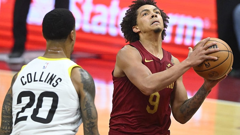 Dec 20, 2023; Cleveland, Ohio, USA; Cleveland Cavaliers guard Craig Porter (9) drives to the basket as Utah Jazz forward John Collins (20) defends in the second quarter at Rocket Mortgage FieldHouse. Mandatory Credit: David Richard-USA TODAY Sports