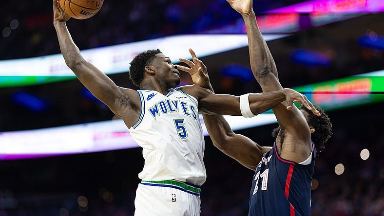 Dec 20, 2023; Philadelphia, Pennsylvania, USA; Minnesota Timberwolves guard Anthony Edwards (5) drives for a shot against Philadelphia 76ers center Joel Embiid (21) during the second quarter at Wells Fargo Center. Mandatory Credit: Bill Streicher-USA TODAY Sports