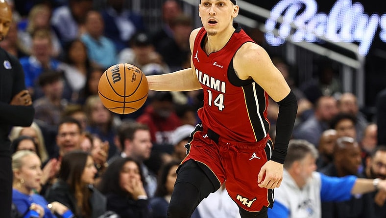 Dec 20, 2023; Orlando, Florida, USA; Miami Heat guard Tyler Herro (14) dribbles the ball against the Orlando Magic during the second quarter at KIA Center. Mandatory Credit: Kim Klement Neitzel-USA TODAY Sports