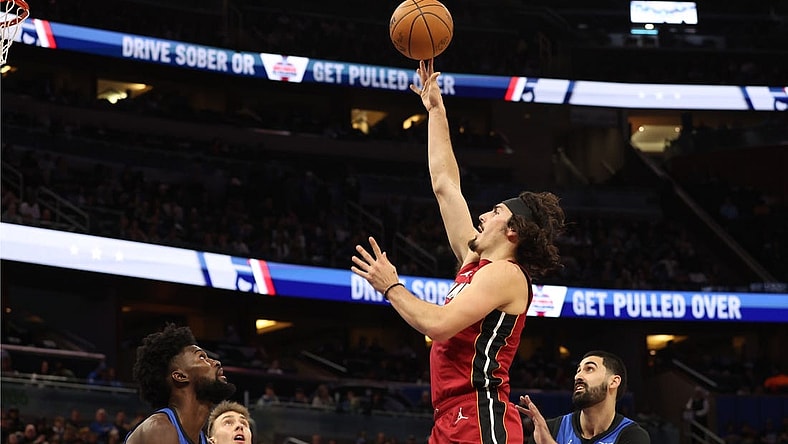 Dec 20, 2023; Orlando, Florida, USA; Miami Heat guard Jaime Jaquez Jr. (11) shoots a layup against the Orlando Magic during the first quarter at KIA Center. Mandatory Credit: Kim Klement Neitzel-USA TODAY Sports