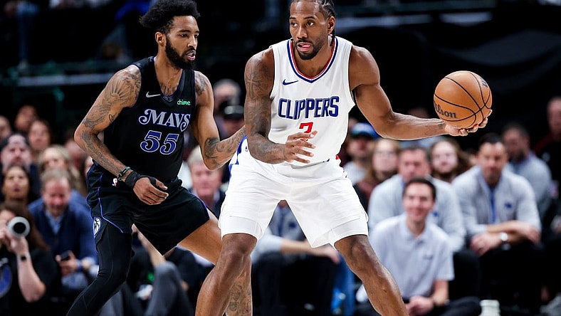 Dec 20, 2023; Dallas, Texas, USA;  LA Clippers forward Kawhi Leonard (2) controls the ball as Dallas Mavericks forward Derrick Jones Jr. (55) defends during the second quarter at American Airlines Center. Mandatory Credit: Kevin Jairaj-USA TODAY Sports