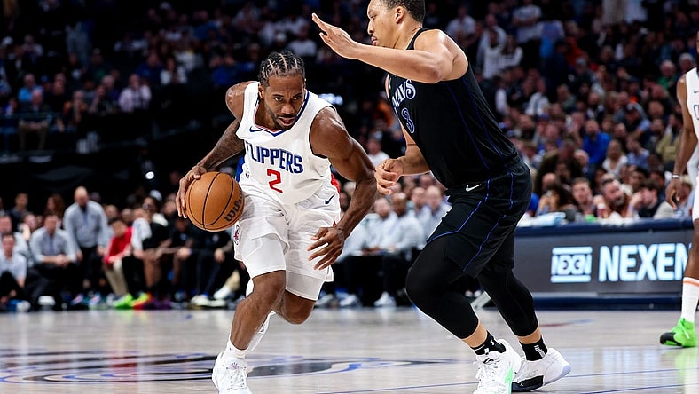 Dec 20, 2023; Dallas, Texas, USA;  LA Clippers forward Kawhi Leonard (2) controls the ball as Dallas Mavericks forward Grant Williams (3) defends during the second half at American Airlines Center. Mandatory Credit: Kevin Jairaj-USA TODAY Sports