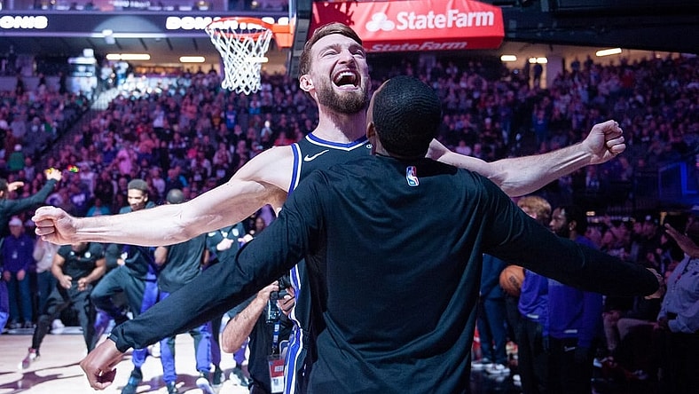 Dec 20, 2023; Sacramento, California, USA; Sacramento Kings forward Domantas Sabonis (10) celebrates with guard De'Aaron Fox (5) during pregame introductions at Golden 1 Center. Mandatory Credit: Ed Szczepanski-USA TODAY Sports