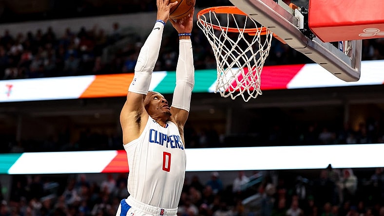 Dec 20, 2023; Dallas, Texas, USA;  LA Clippers guard Russell Westbrook (0) dunks the ball during the second half against the Dallas Mavericks at American Airlines Center. Mandatory Credit: Kevin Jairaj-USA TODAY Sports