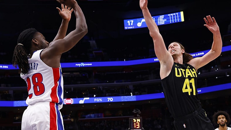 Dec 21, 2023; Detroit, Michigan, USA;  Detroit Pistons center Isaiah Stewart (28) shoots on Utah Jazz forward Kelly Olynyk (41) in the first half at Little Caesars Arena. Mandatory Credit: Rick Osentoski-USA TODAY Sports