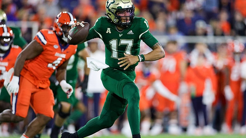 Dec 21, 2023; Boca Raton, FL, USA; South Florida Bulls quarterback Byrum Brown (17) drops back to pass against the Syracuse Orange in the first quarter during the RoofClaim.com Boca Raton Bowl at FAU Stadium. Mandatory Credit: Nathan Ray Seebeck-USA TODAY Sports