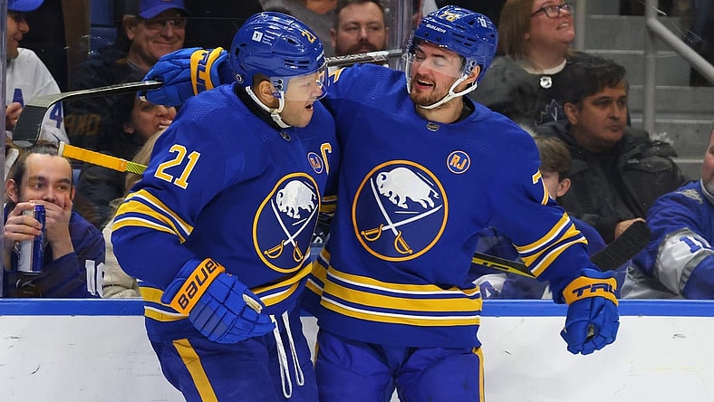 Dec 21, 2023; Buffalo, New York, USA;  Buffalo Sabres right wing Kyle Okposo (21) celebrates his shorthanded goal with defenseman Connor Clifton (75) during the second period against the Toronto Maple Leafs at KeyBank Center. Mandatory Credit: Timothy T. Ludwig-USA TODAY Sports