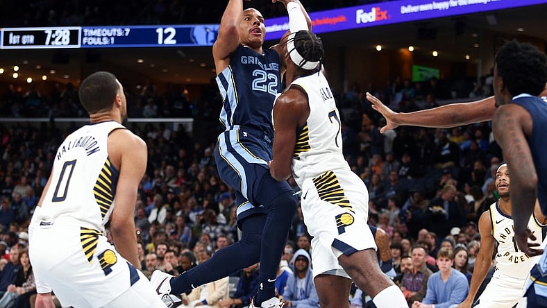 Dec 21, 2023; Memphis, Tennessee, USA; Memphis Grizzlies guard Desmond Bane (22) shoots as Indiana Pacers guard Buddy Hield (7) defends during the first half at FedExForum. Mandatory Credit: Petre Thomas-USA TODAY Sports